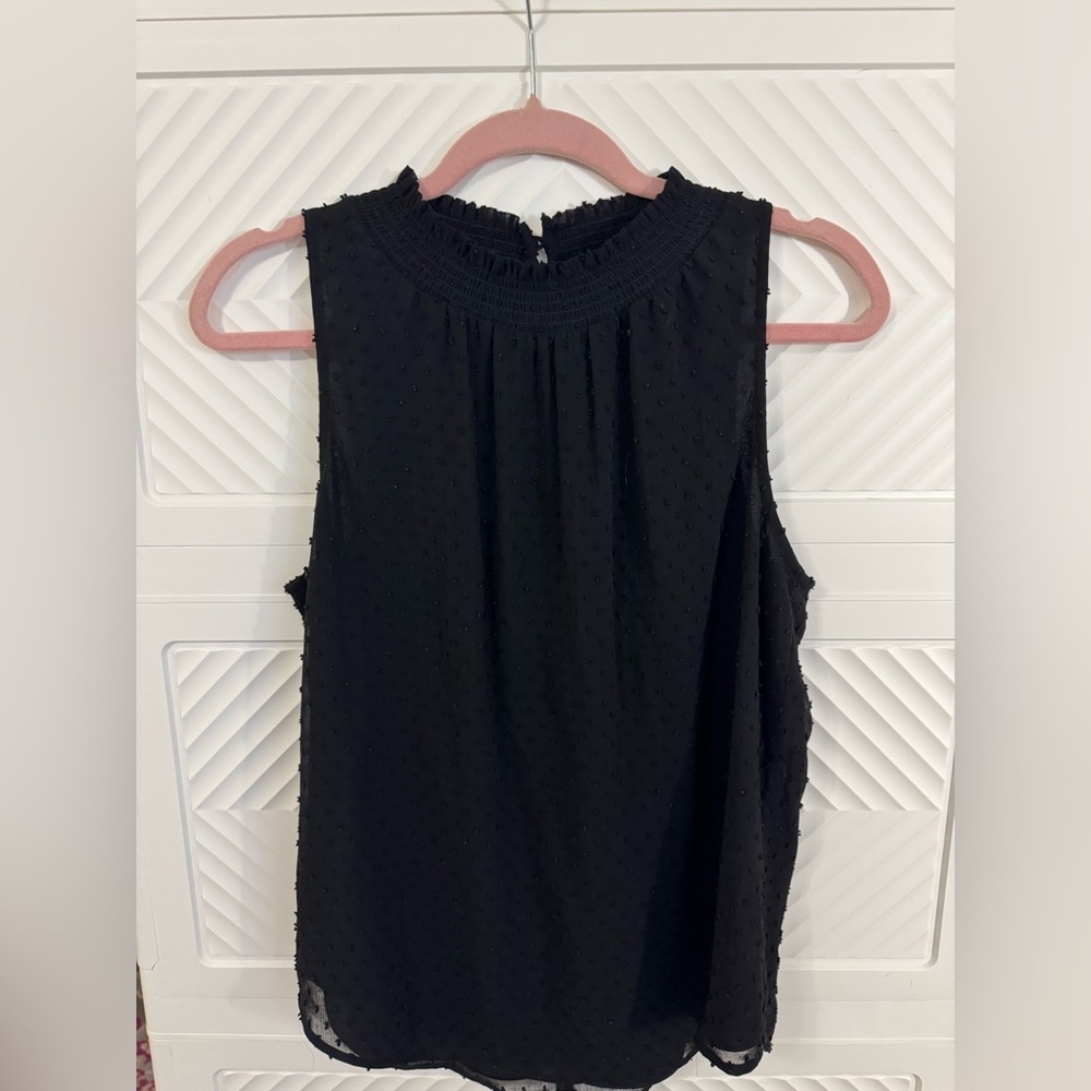Daniel Rainn black sleeveless top.